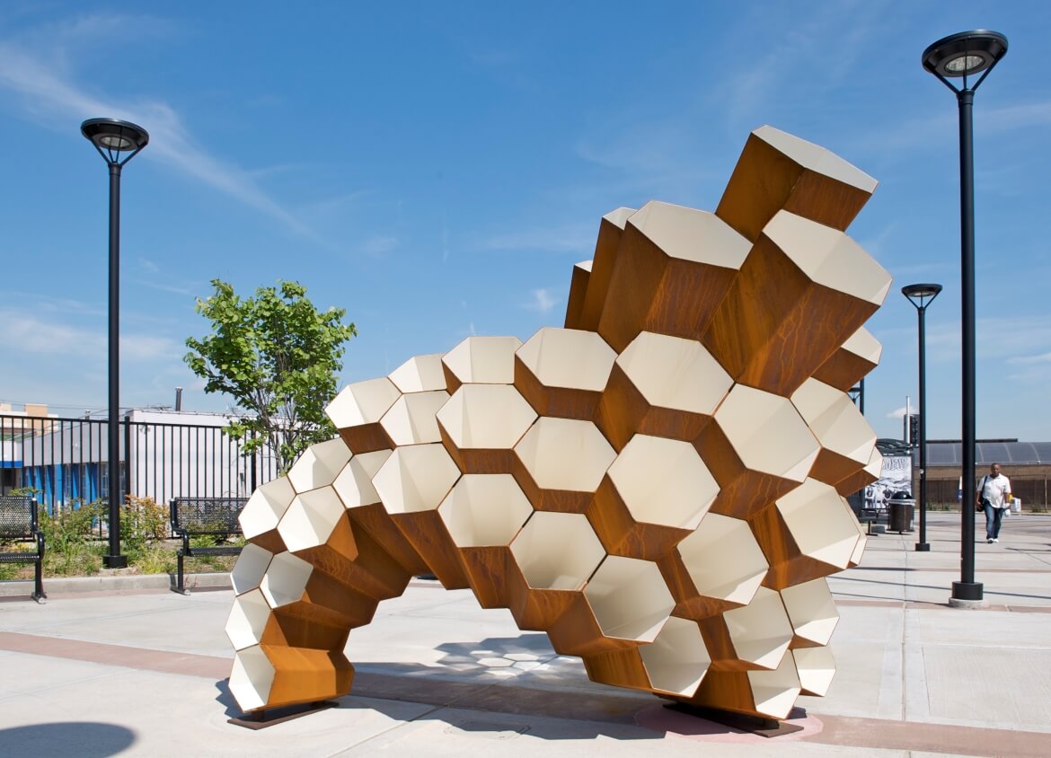 Hive is a public art sculpture by artist Janet Lofquist installed at the Delmar Transit Plaza. The sculpture is made of COR-TEN steel and has a honeycomb structure, symbolizing the collective spirit of the community.