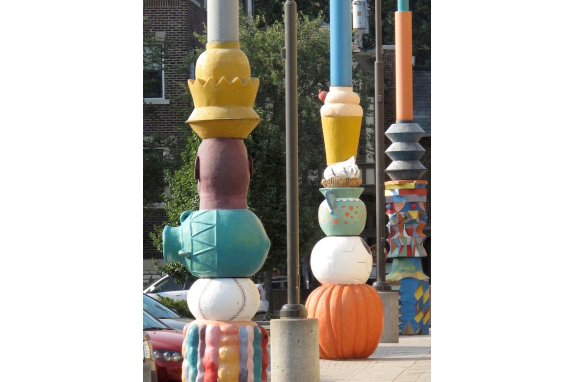 Vertical Loop is an installation of seven colorful, fiberglass sculptures along the Pageant Walkway in the Delmar Loop that were created by artist Ron Fondaw. Each is topped with a weather vane symbolizing four arts disciplines: visual art, dance, literature, and music.