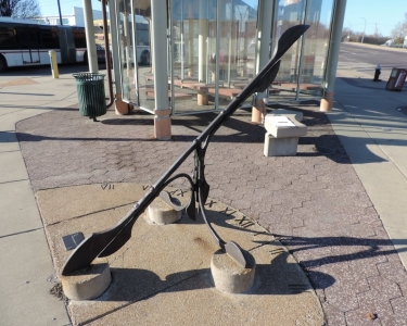 Sundial is a wrought-iron public art sculpture installed at the North Broadway Transit center. It was designed by artist Noah Kirby.