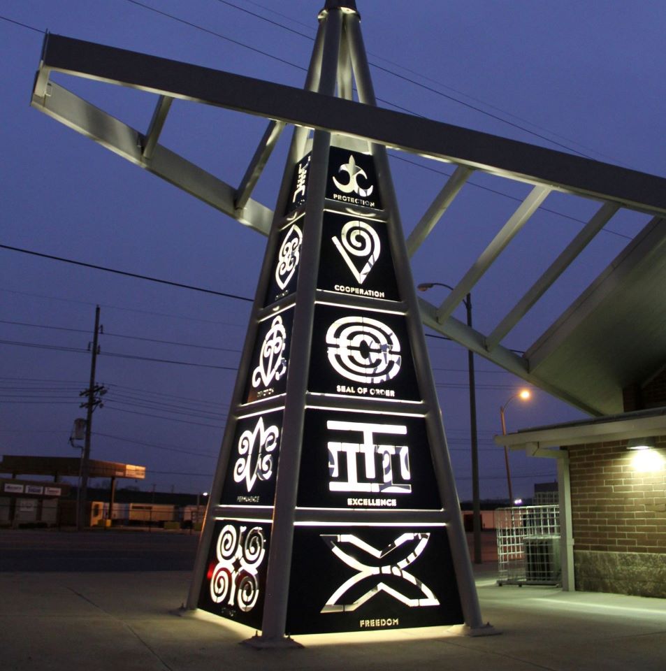 Adinkra Tower is a public art sculpture created by artist Thomas Sleet that is located at the Riverview MetroBus Center. The sculpture is made of painted, water jet-cut aluminum panels that depict various Adinkra symbols, originating from the Ashanti people of Ghana, West Africa.